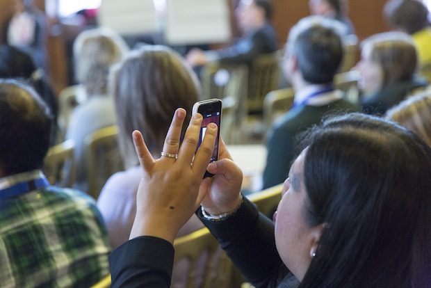 Woman taking a photo on a mobile phone