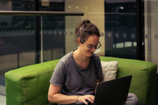 A developer working on her laptop